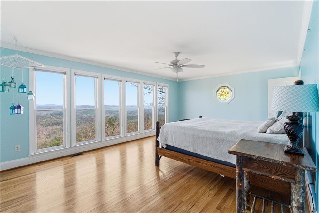 1015 Eagle Ridge Road Dawsonville, GA 30534 - Photo 26 of 64 a bedroom with furniture and wooden floor
