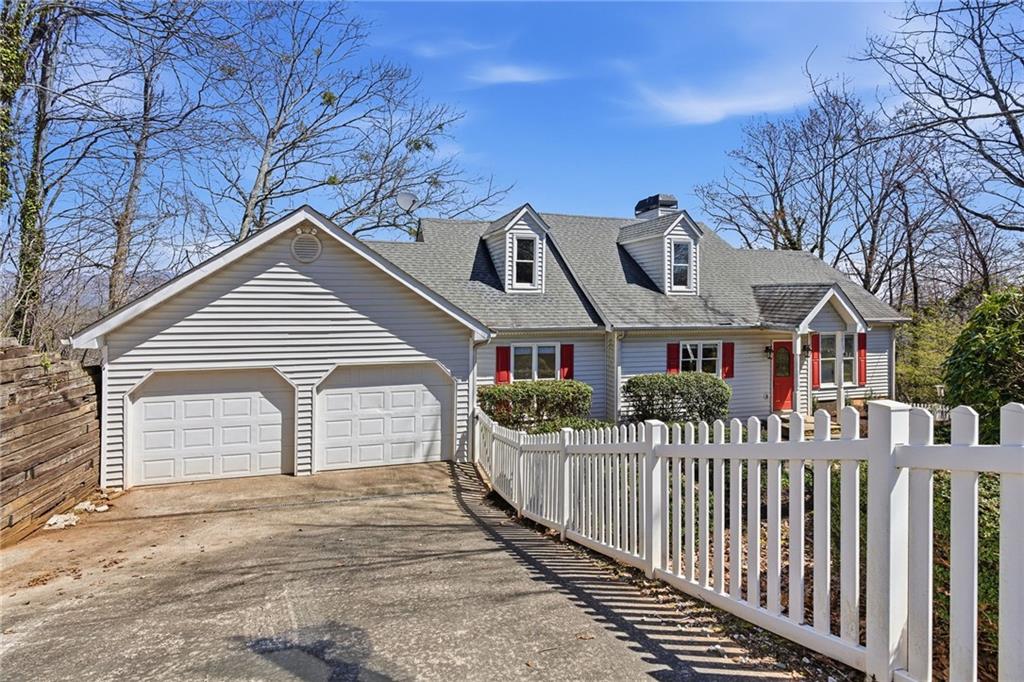 1015 Eagle Ridge Road Dawsonville, GA 30534 - Photo 3 of 64 a front view of a house with a yard