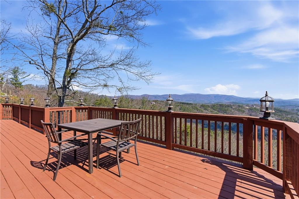 1015 Eagle Ridge Road Dawsonville, GA 30534 - Photo 31 of 64 a view of a wooden deck with furniture