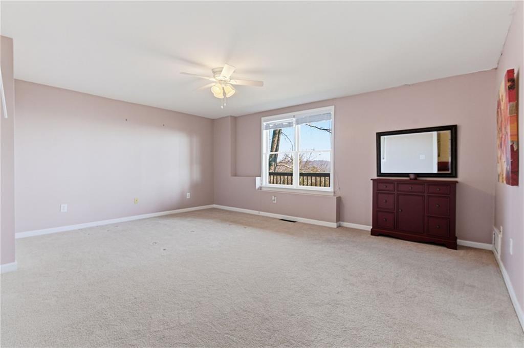 1015 Eagle Ridge Road Dawsonville, GA 30534 - Photo 36 of 64 a view of an empty room with a window