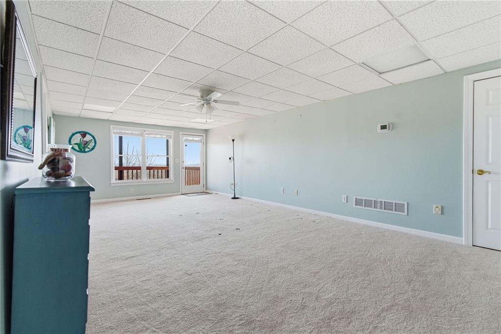 1015 Eagle Ridge Road Dawsonville, GA 30534 - Photo 38 of 64 a view of a livingroom and a chandelier fan