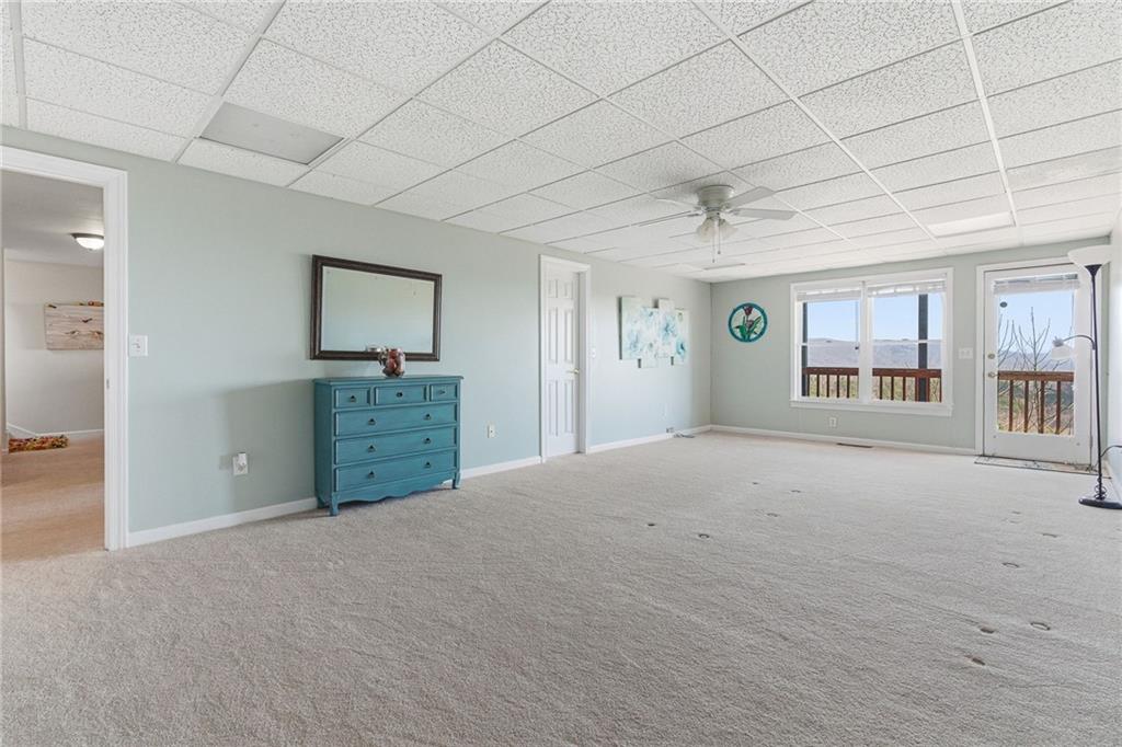 1015 Eagle Ridge Road Dawsonville, GA 30534 - Photo 39 of 64 a view of an empty room with a window