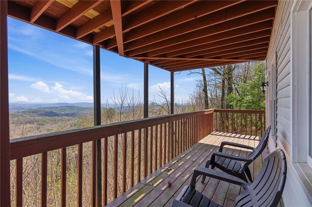 1015 Eagle Ridge Road Dawsonville, GA 30534 - Photo 41 of 64 a view of a two chairs in the balcony