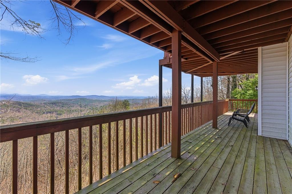 1015 Eagle Ridge Road Dawsonville, GA 30534 - Photo 42 of 64 a view of a balcony with wooden floor