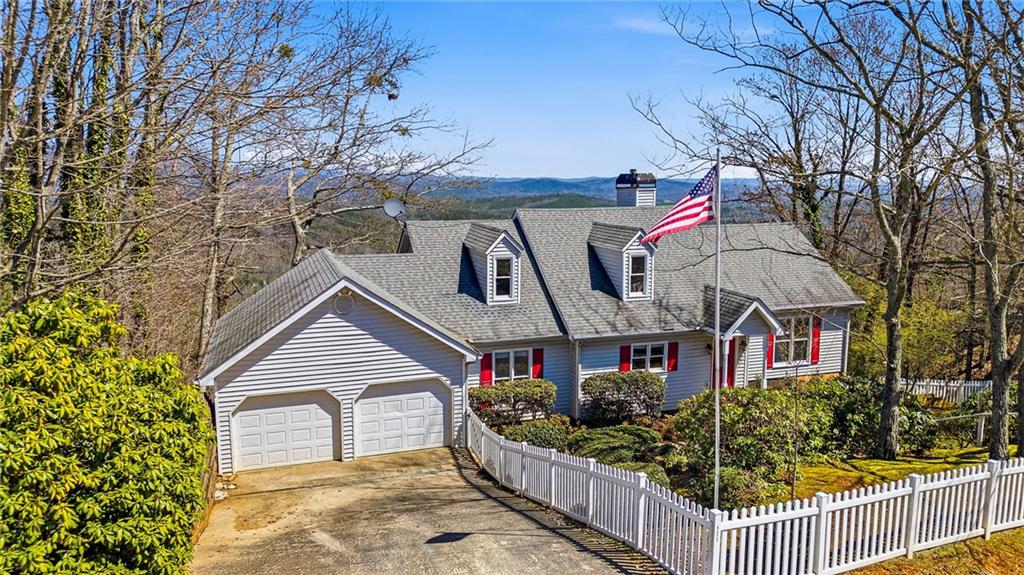 1015 Eagle Ridge Road Dawsonville, GA 30534 - Photo 6 of 64 a front view of a house with a yard