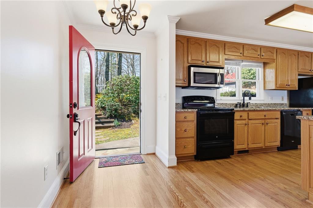 1015 Eagle Ridge Road Dawsonville, GA 30534 - Photo 8 of 64 a kitchen with a sink stove and cabinets
