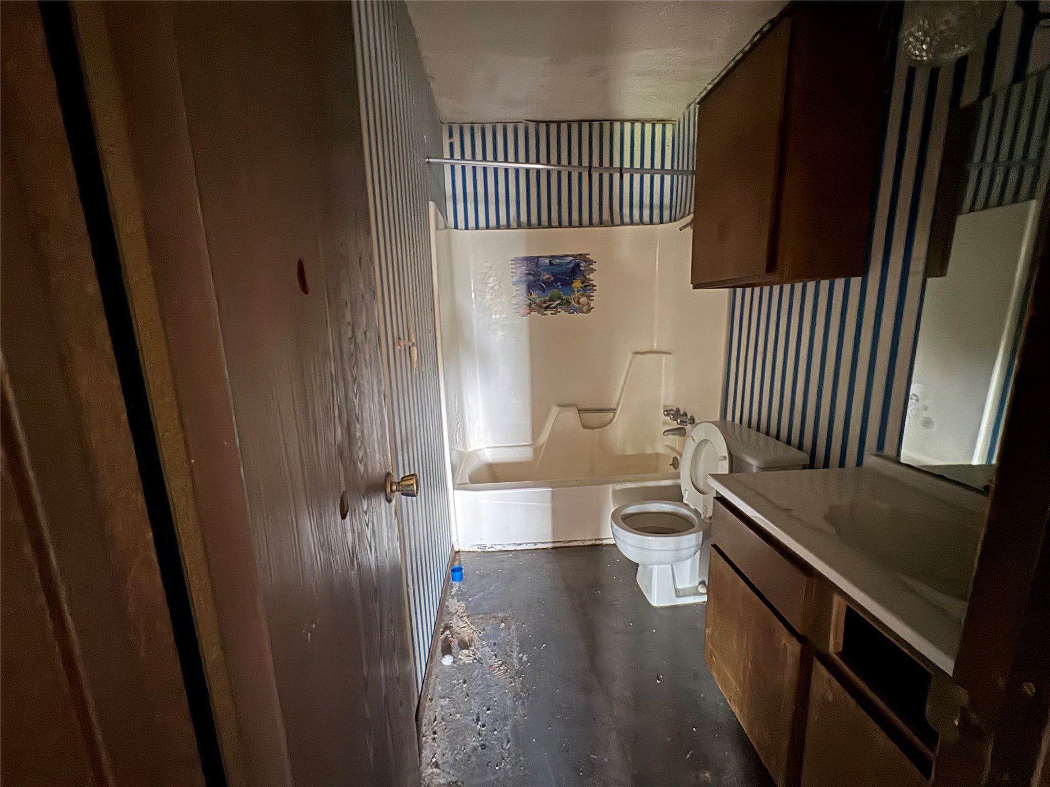 709 Drake Lane Taylor, TX 76574 - Photo 11 of 17 a bathroom with a toilet a sink and mirror