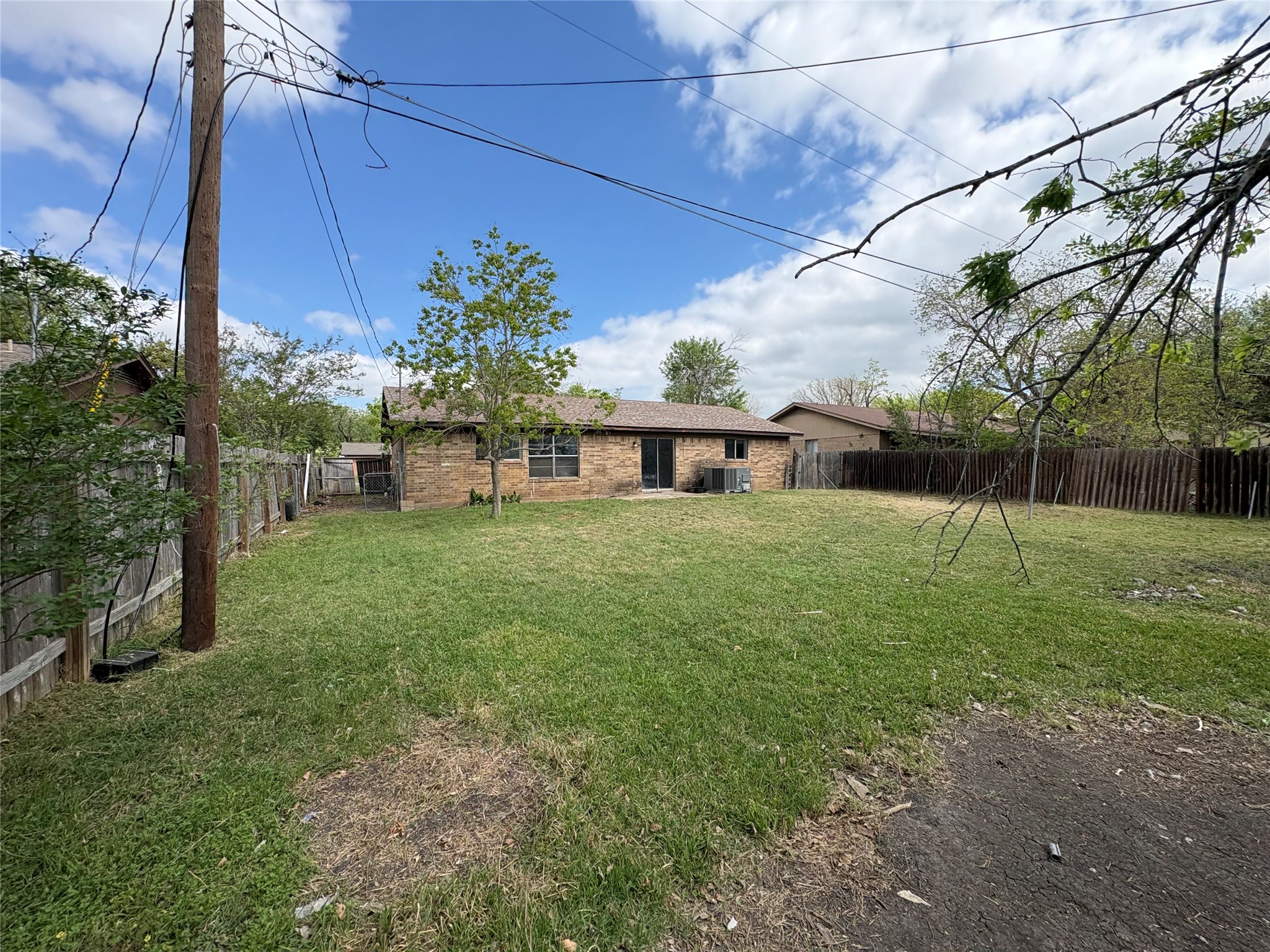 709 Drake Lane Taylor, TX 76574 - Photo 16 of 17 a view of a house with backyard and sitting area