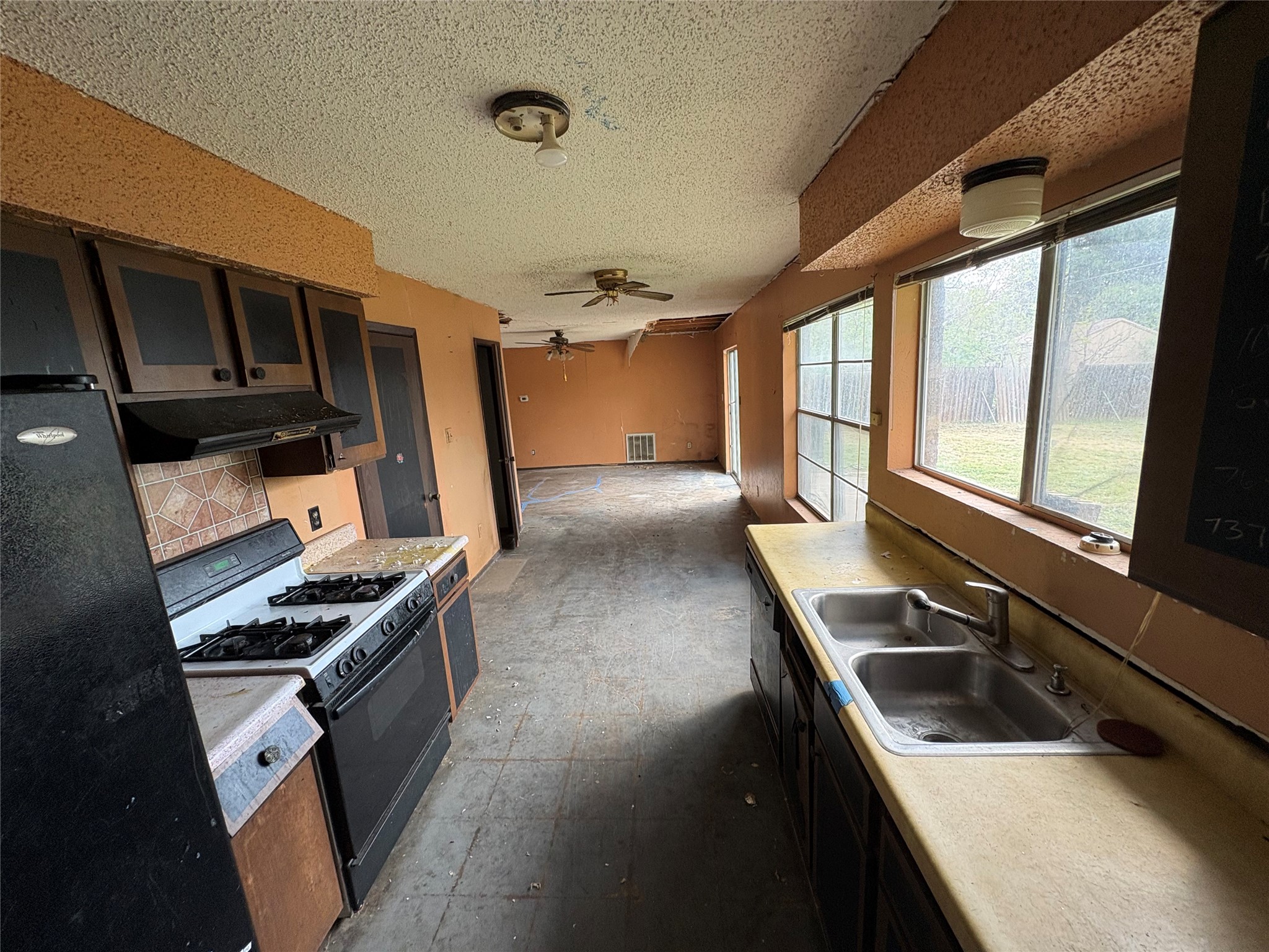 709 Drake Lane Taylor, TX 76574 - Photo 17 of 17 a kitchen with stainless steel appliances granite countertop a sink stove and refrigerator