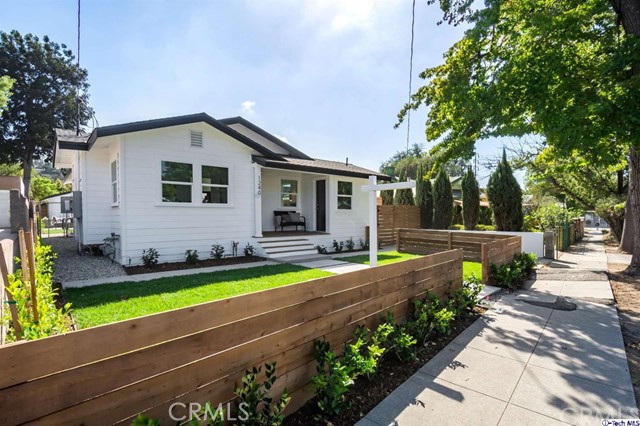 1240 Neola Street Eagle Rock, CA 90041 - Photo 1 of 19 a front view of a house with swimming pool