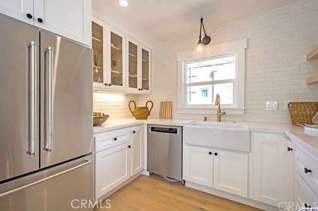 1240 Neola Street Eagle Rock, CA 90041 - Photo 15 of 19 a kitchen with a refrigerator sink and cabinets