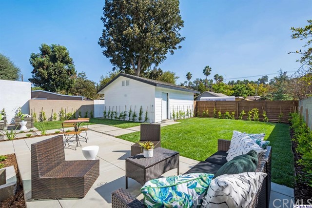 1240 Neola Street Eagle Rock, CA 90041 - Photo 19 of 19 a view of a patio with couches chairs and a table and chairs with the garden