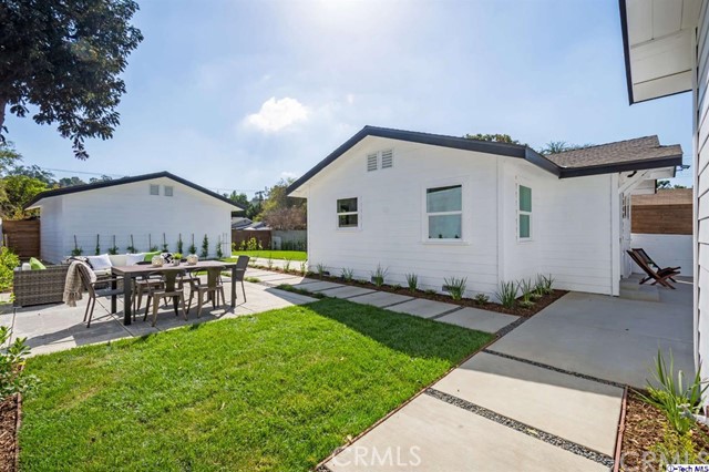 1240 Neola Street Eagle Rock, CA 90041 - Photo 4 of 19 a view of a house with backyard and a garden