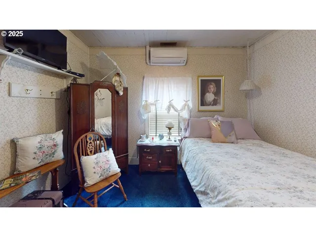 a living room with a bed and furniture