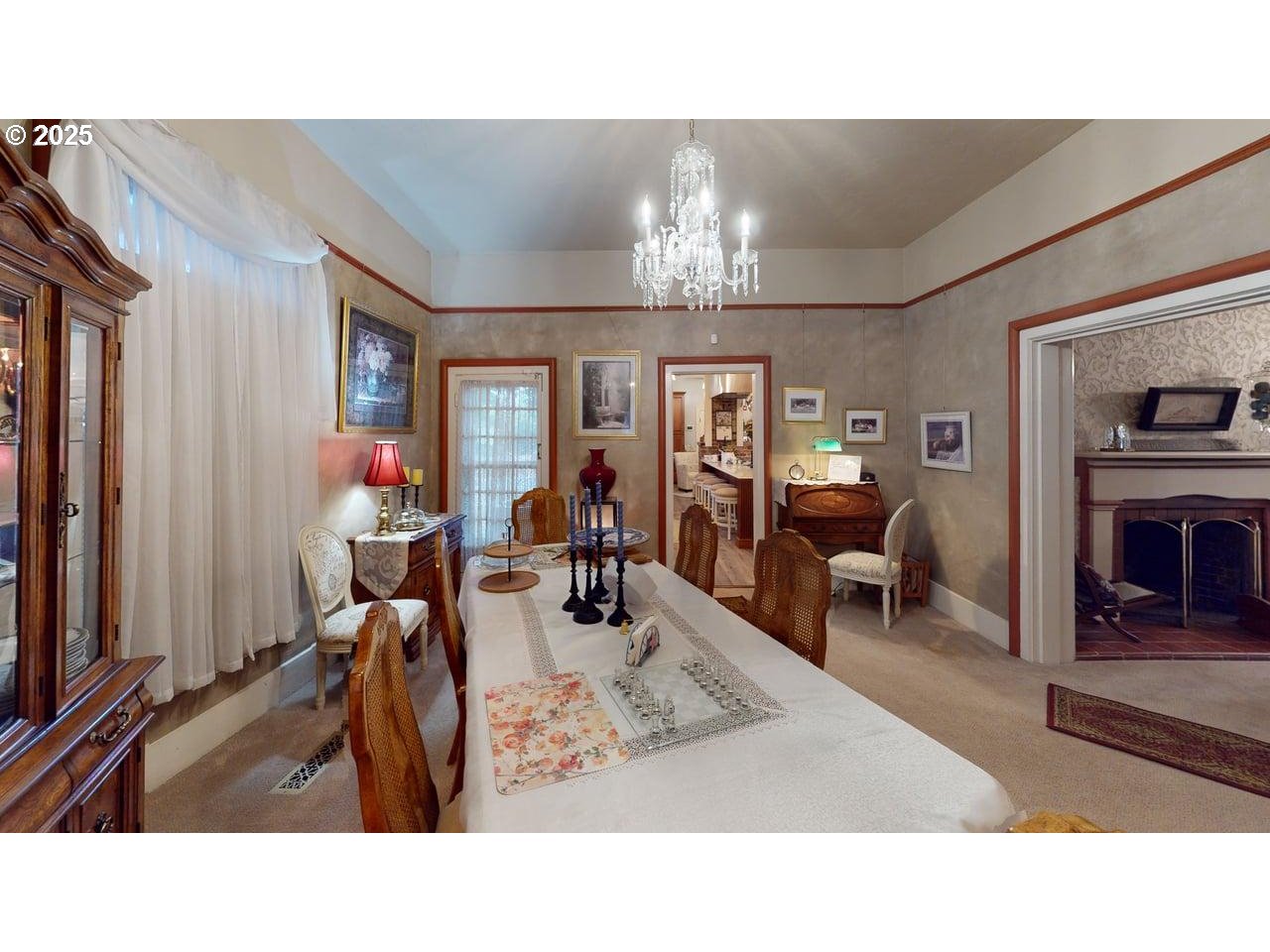 706 West Steuben Street Bingen, WA 98605 - Photo 13 of 32 a living room with furniture a chandelier and a flat screen tv
