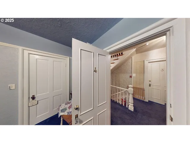 a open kitchen with stainless steel appliances kitchen island granite countertop a refrigerator and a sink