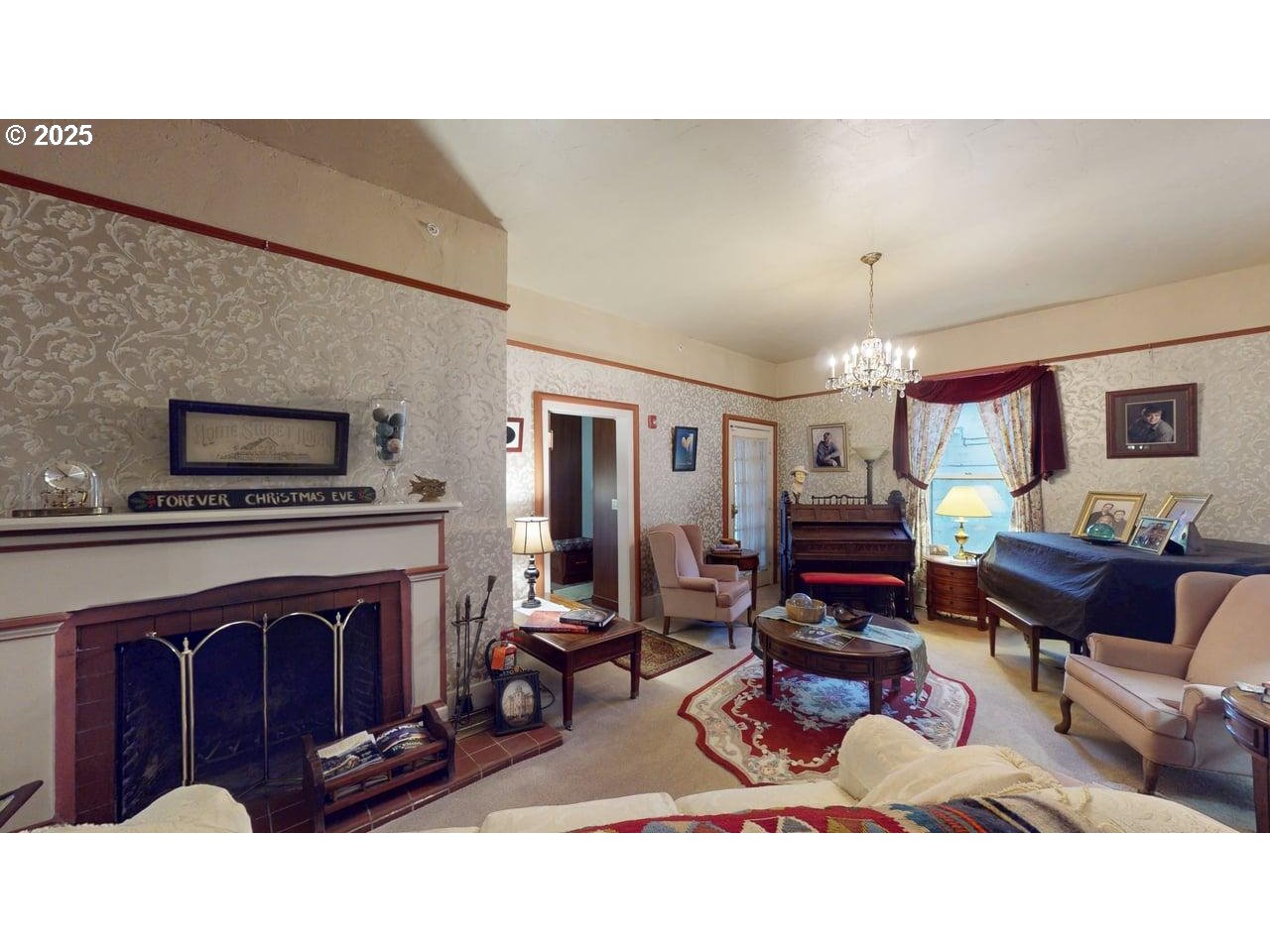 706 West Steuben Street Bingen, WA 98605 - Photo 22 of 32 a living room with furniture a fireplace and a flat screen tv