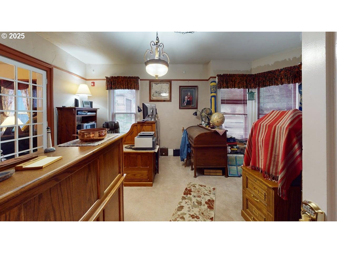 706 West Steuben Street Bingen, WA 98605 - Photo 9 of 32 a living room with furniture a flat screen tv and kitchen view