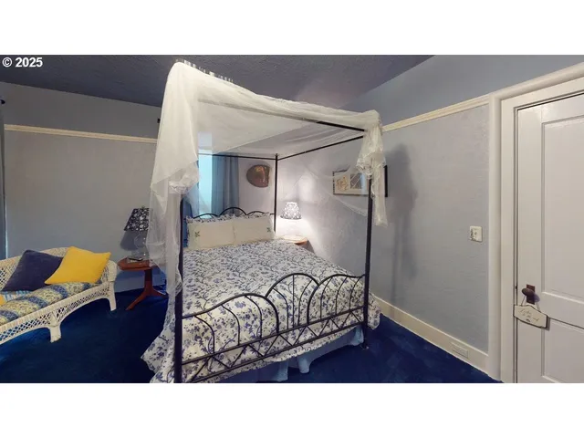 a living room with furniture and a lamp