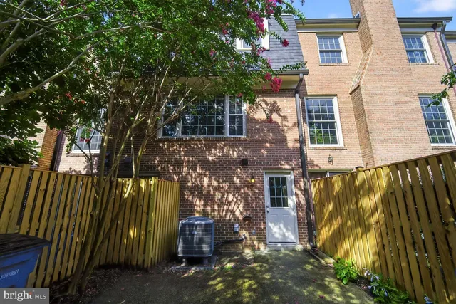 a view of a house with a tree