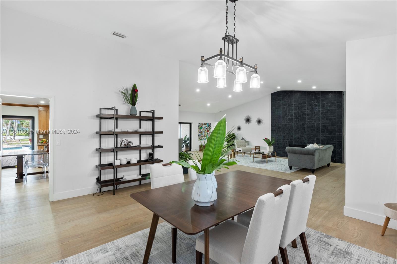 501 Ranch Road Weston, FL 33326 - Photo 11 of 50 a view of a dining room with furniture and wooden floor