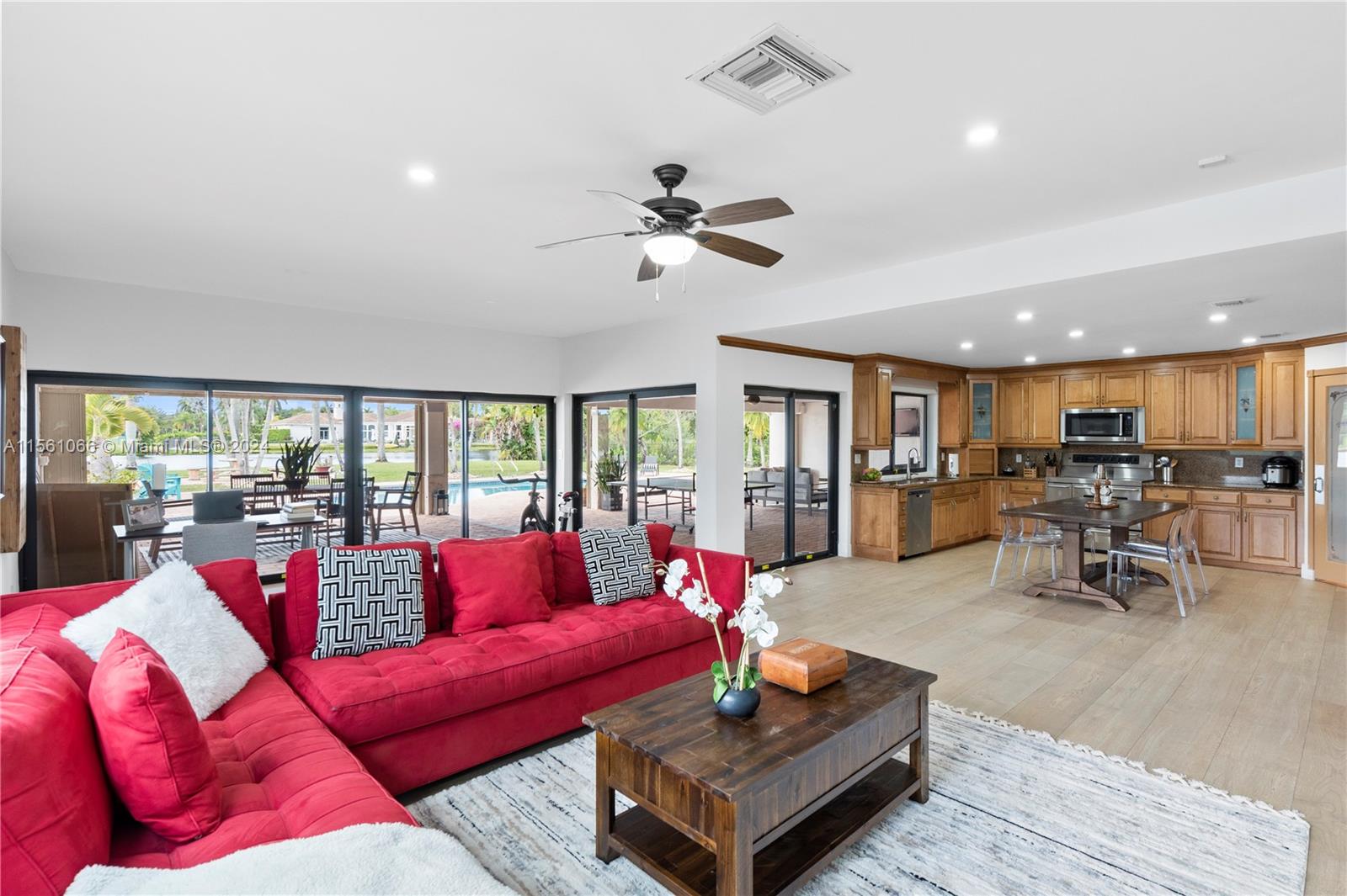 501 Ranch Road Weston, FL 33326 - Photo 17 of 50 a living room with furniture a table and a large window