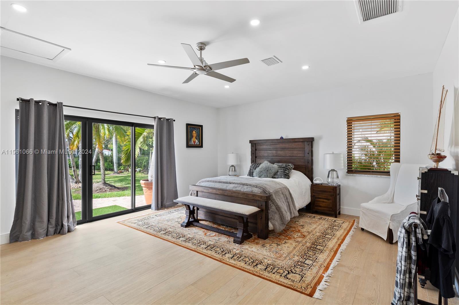 501 Ranch Road Weston, FL 33326 - Photo 24 of 50 a bedroom with a large bed and a window