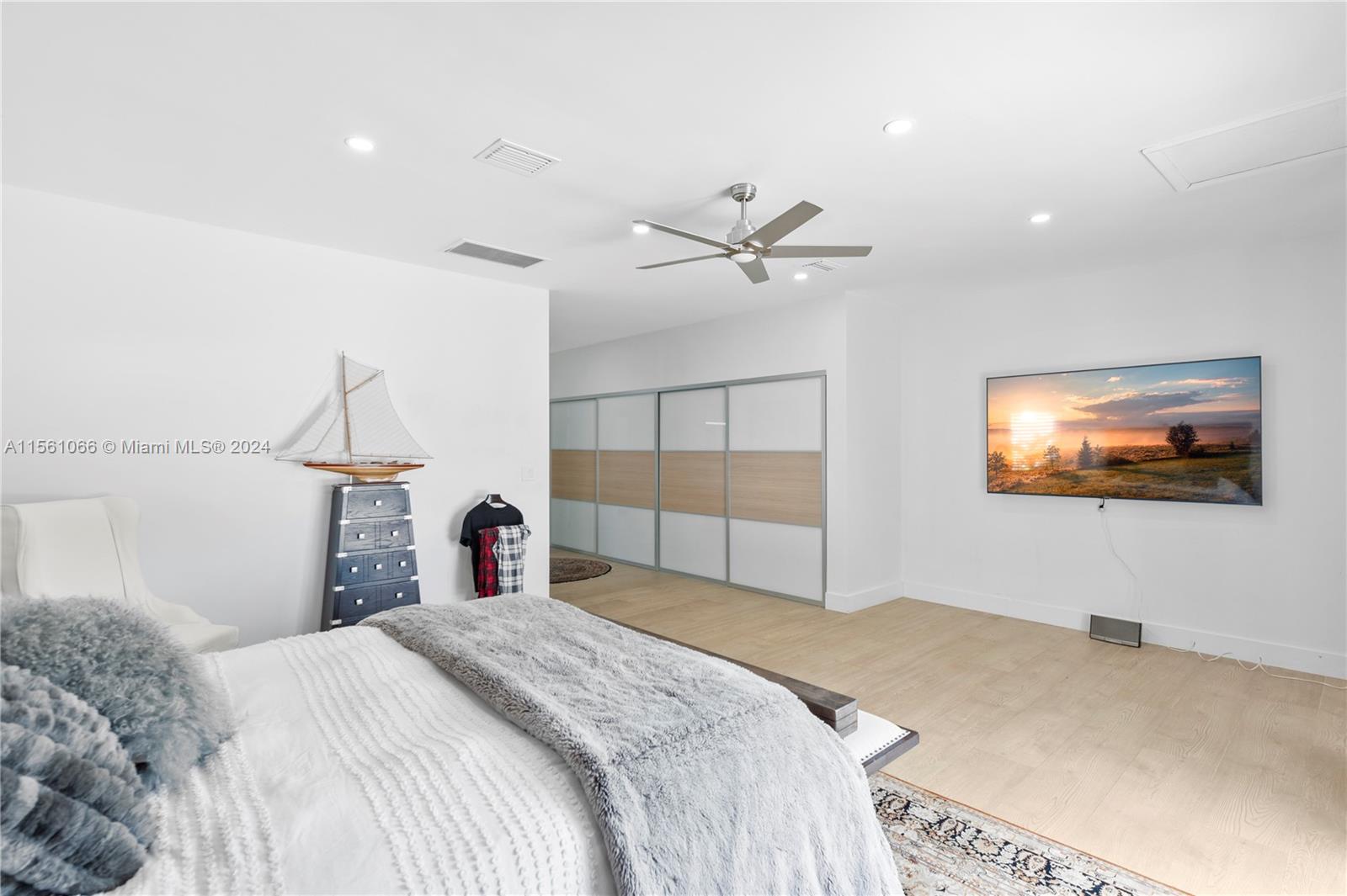 501 Ranch Road Weston, FL 33326 - Photo 25 of 50 a bedroom with a bed and a flat screen tv