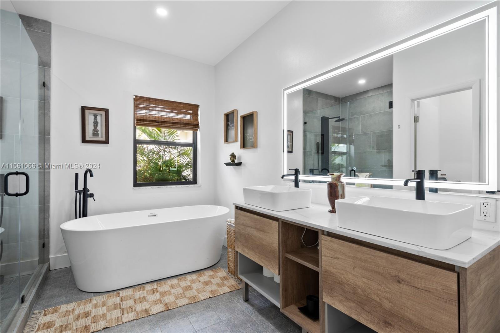 501 Ranch Road Weston, FL 33326 - Photo 28 of 50 a bathroom with a bathtub a sink and a window