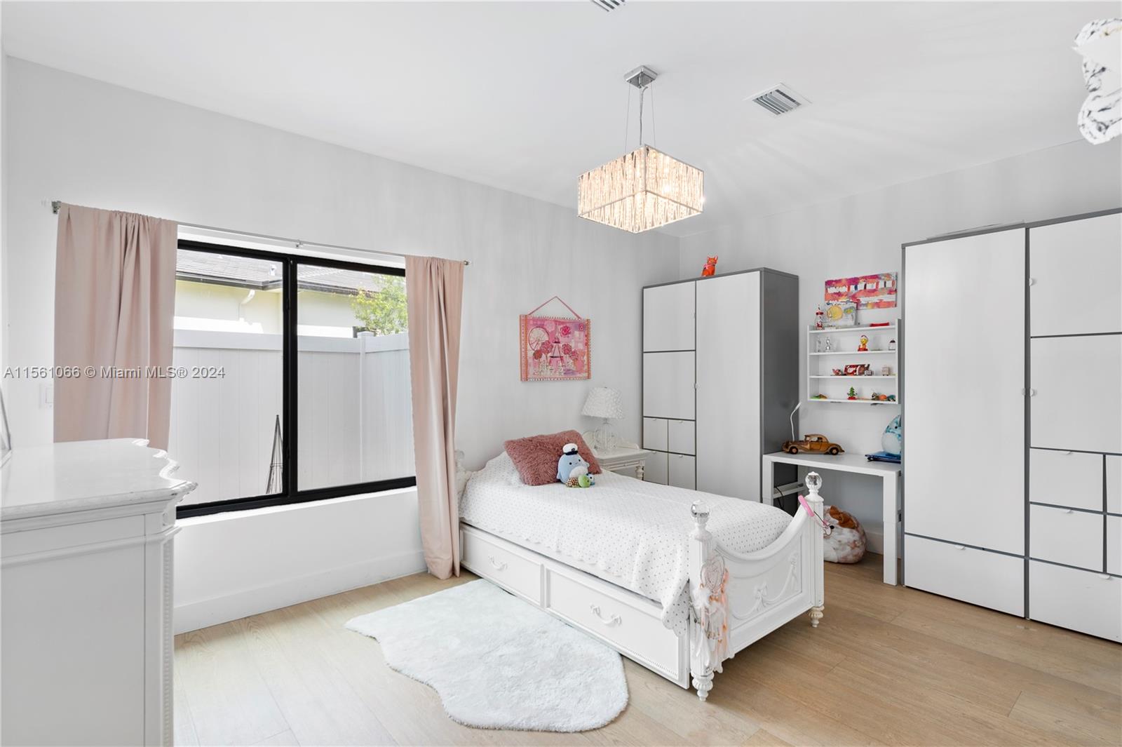 501 Ranch Road Weston, FL 33326 - Photo 32 of 50 a bedroom with a bed and a large window