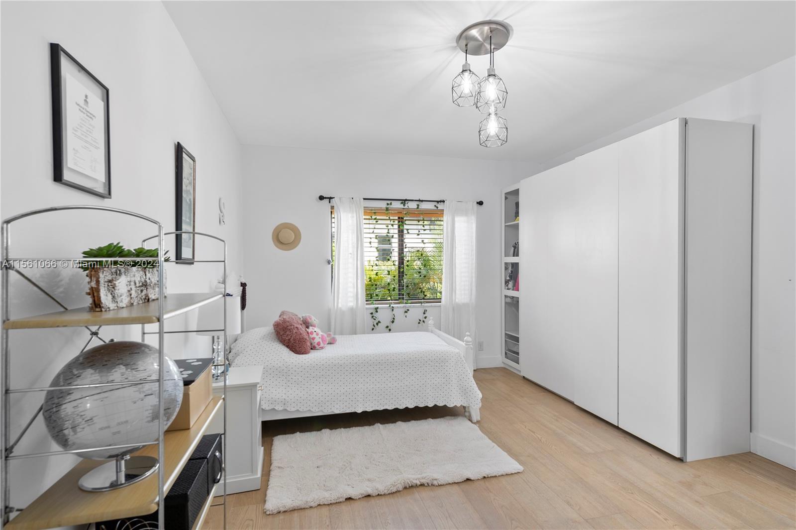 501 Ranch Road Weston, FL 33326 - Photo 33 of 50 a bedroom with a bed and window