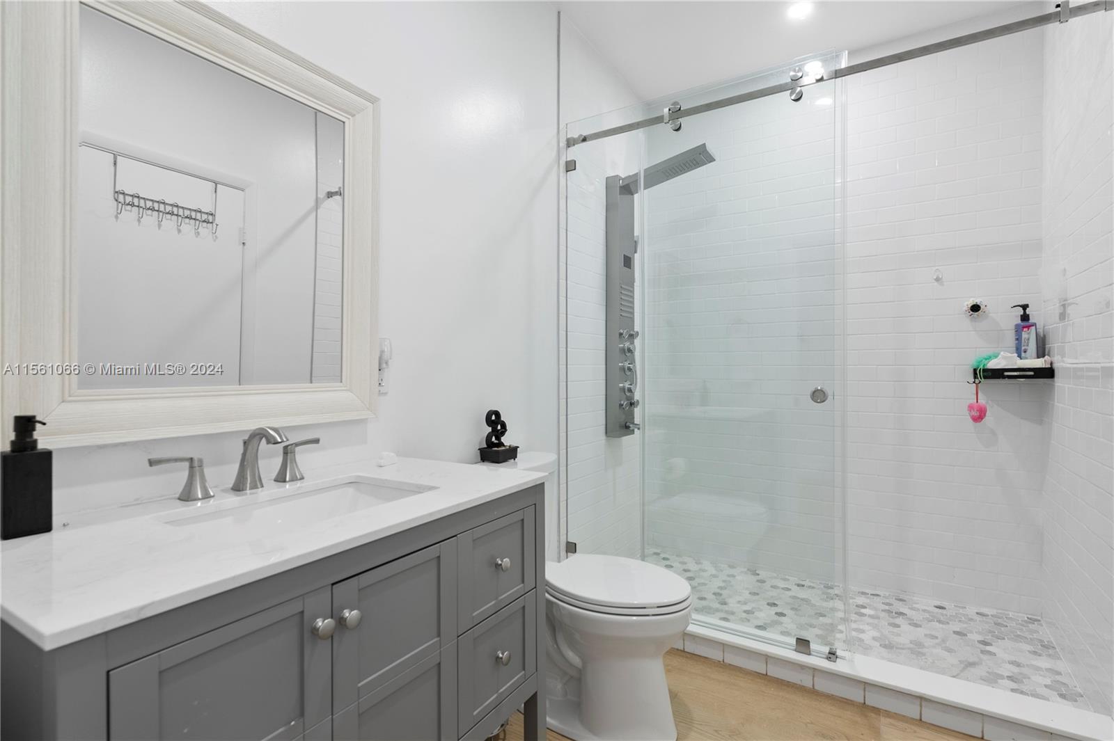 501 Ranch Road Weston, FL 33326 - Photo 34 of 50 a bathroom with a sink a toilet and shower