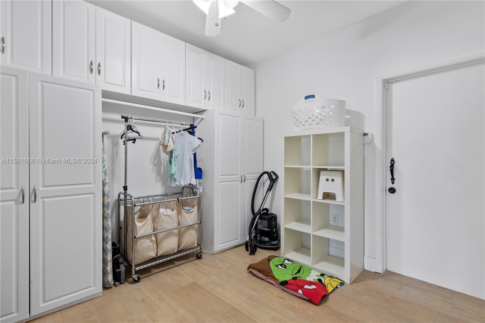 501 Ranch Road Weston, FL 33326 - Photo 37 of 50 a view of walk in closet with clothes and shoes