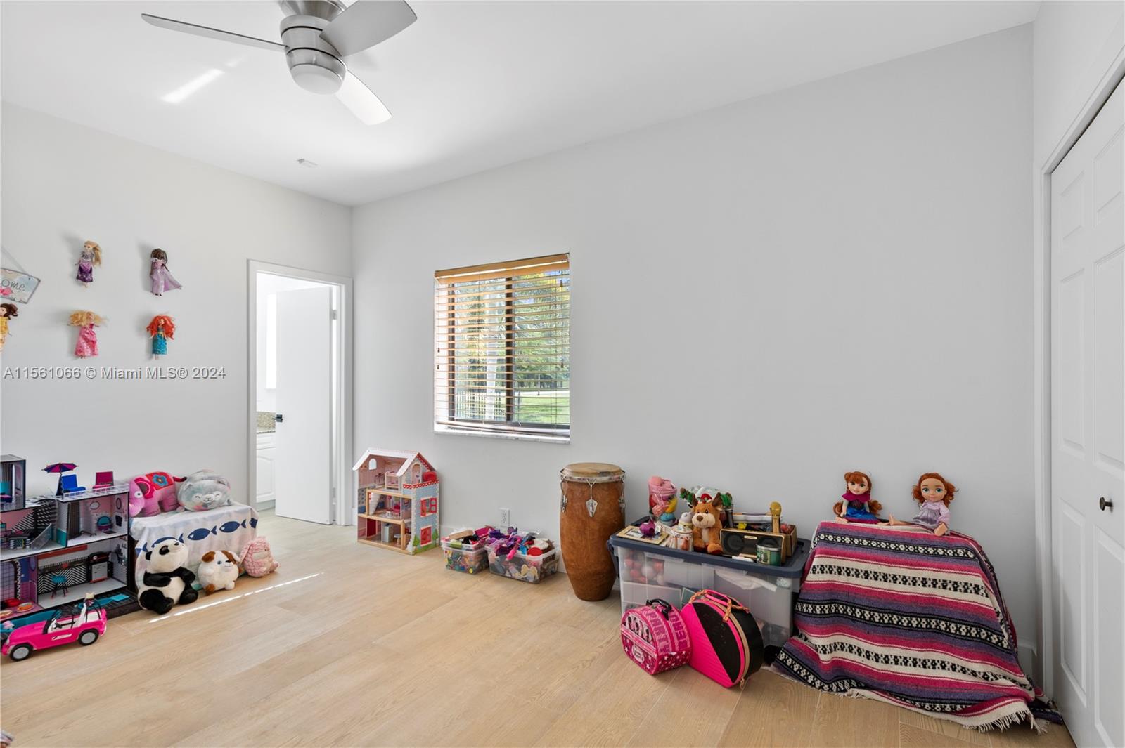 501 Ranch Road Weston, FL 33326 - Photo 38 of 50 a bed room with a bed and a chandelier