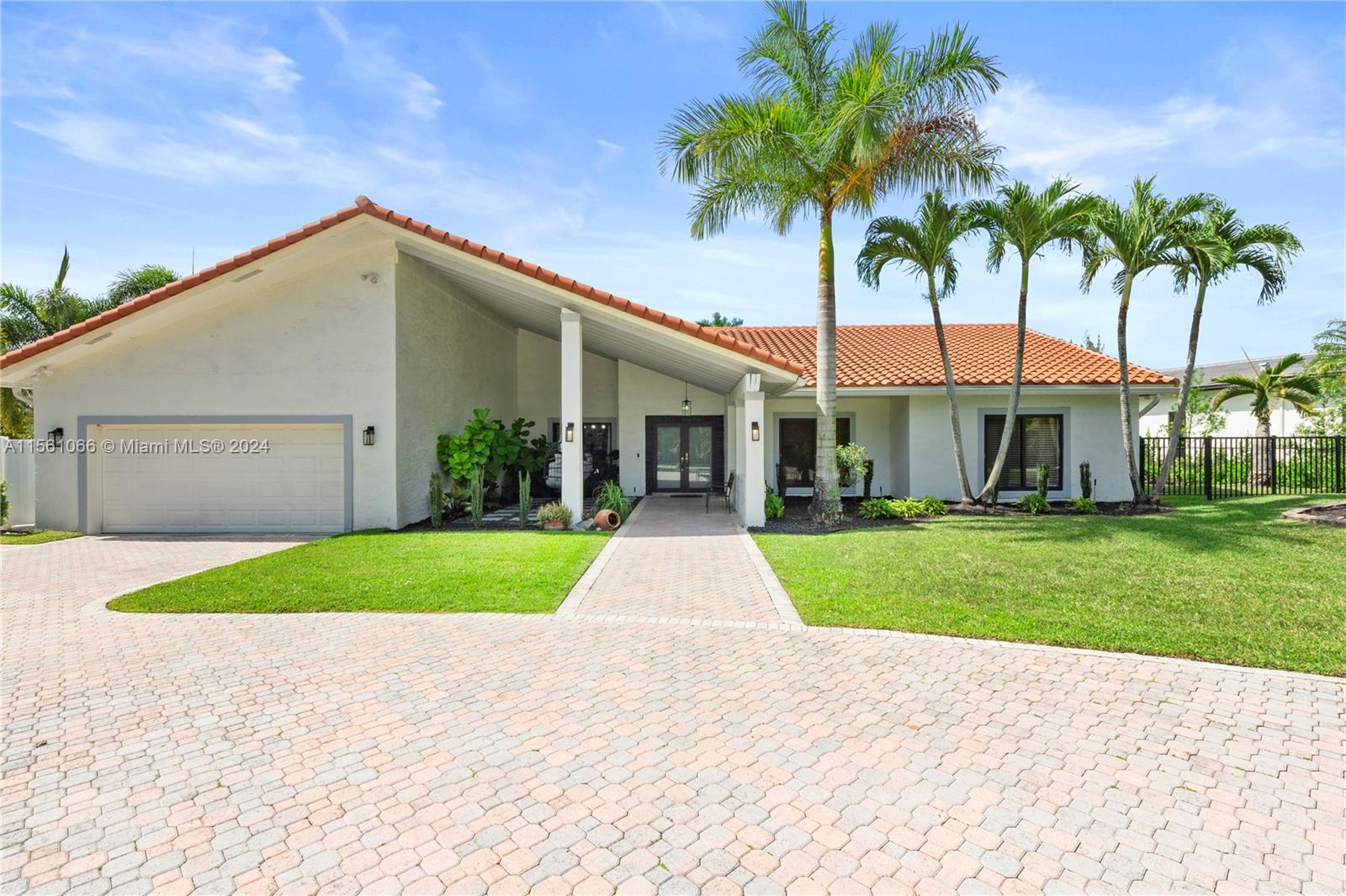 501 Ranch Road Weston, FL 33326 - Photo 4 of 50 a view of a yard and a garage