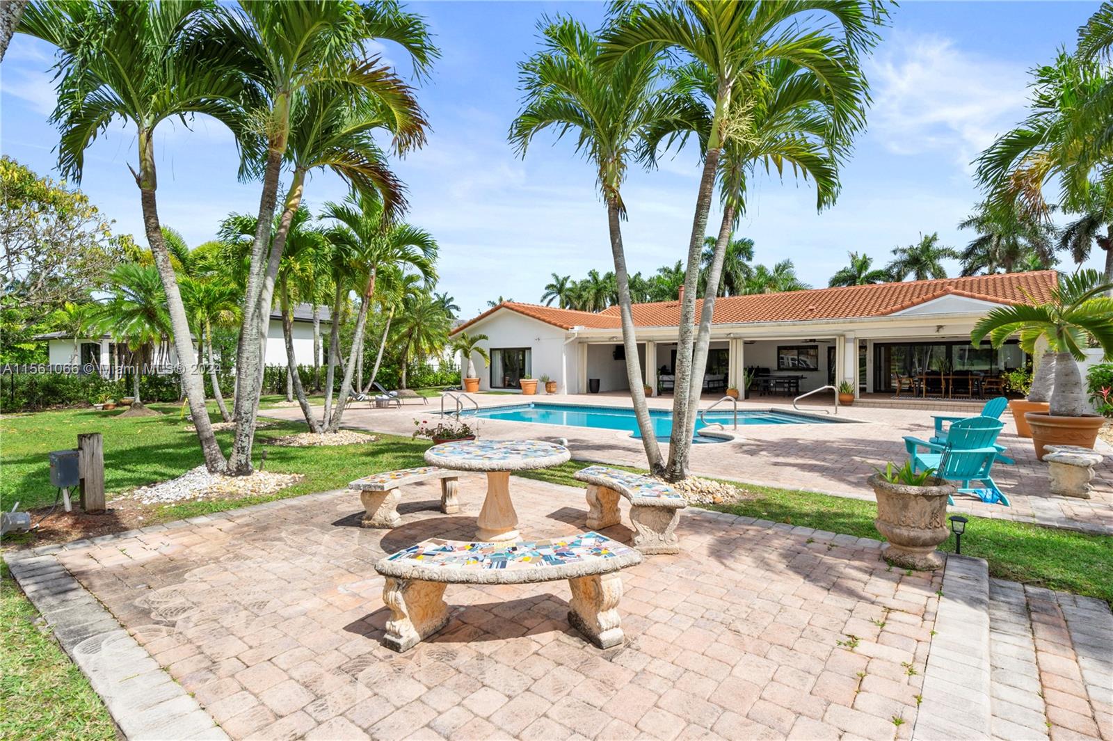 501 Ranch Road Weston, FL 33326 - Photo 45 of 50 a swimming pool with outdoor seating and yard