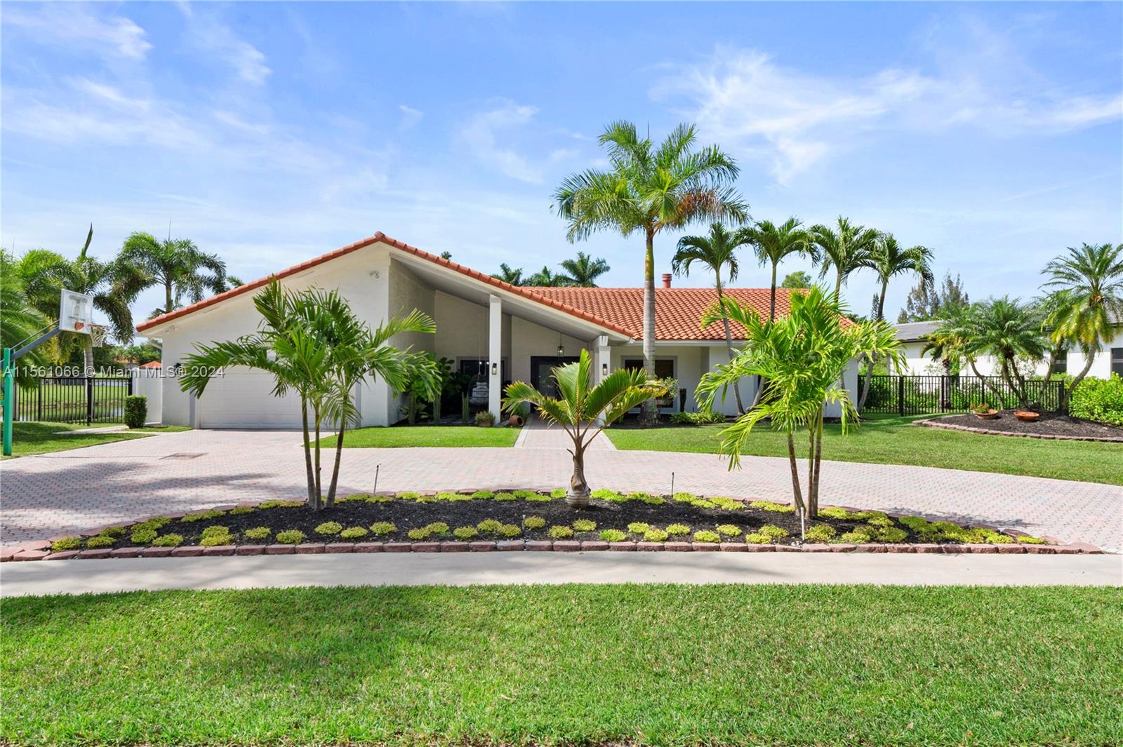 501 Ranch Road Weston, FL 33326 - Photo 49 of 50 a view of a house with a yard and palm trees