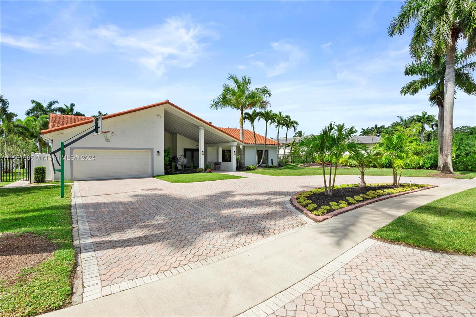 501 Ranch Road Weston, FL 33326 - Photo 6 of 50 a front view of a house with a yard and garage