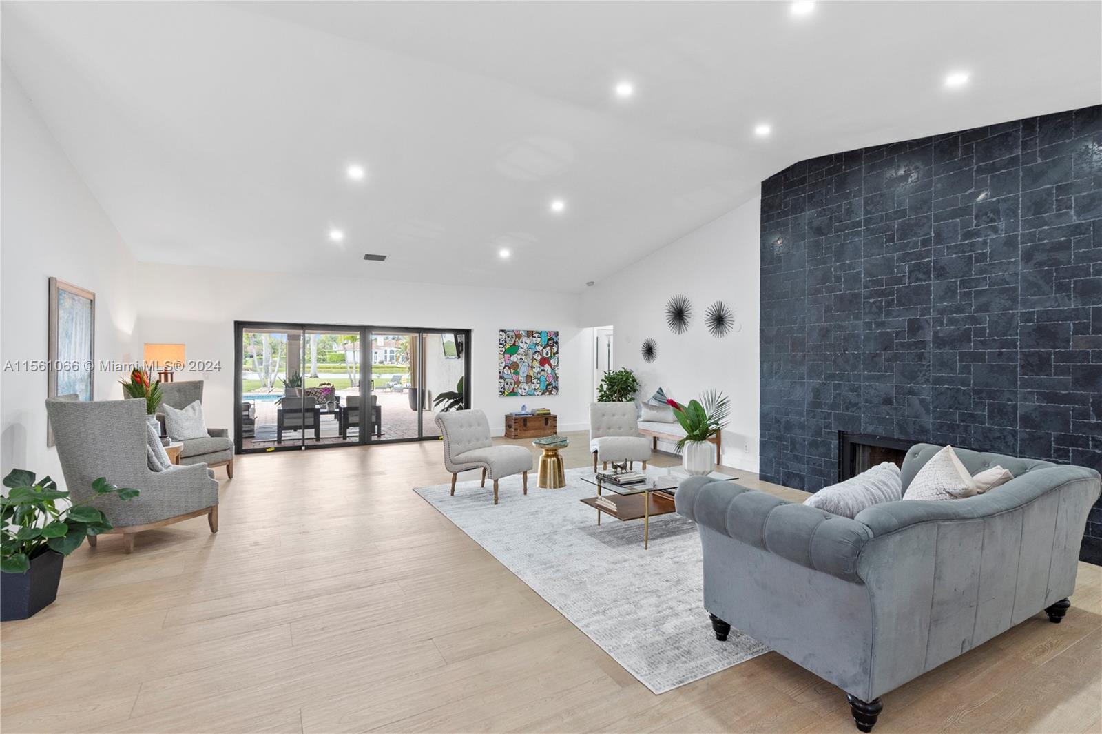 501 Ranch Road Weston, FL 33326 - Photo 9 of 50 a living room with furniture and a fireplace