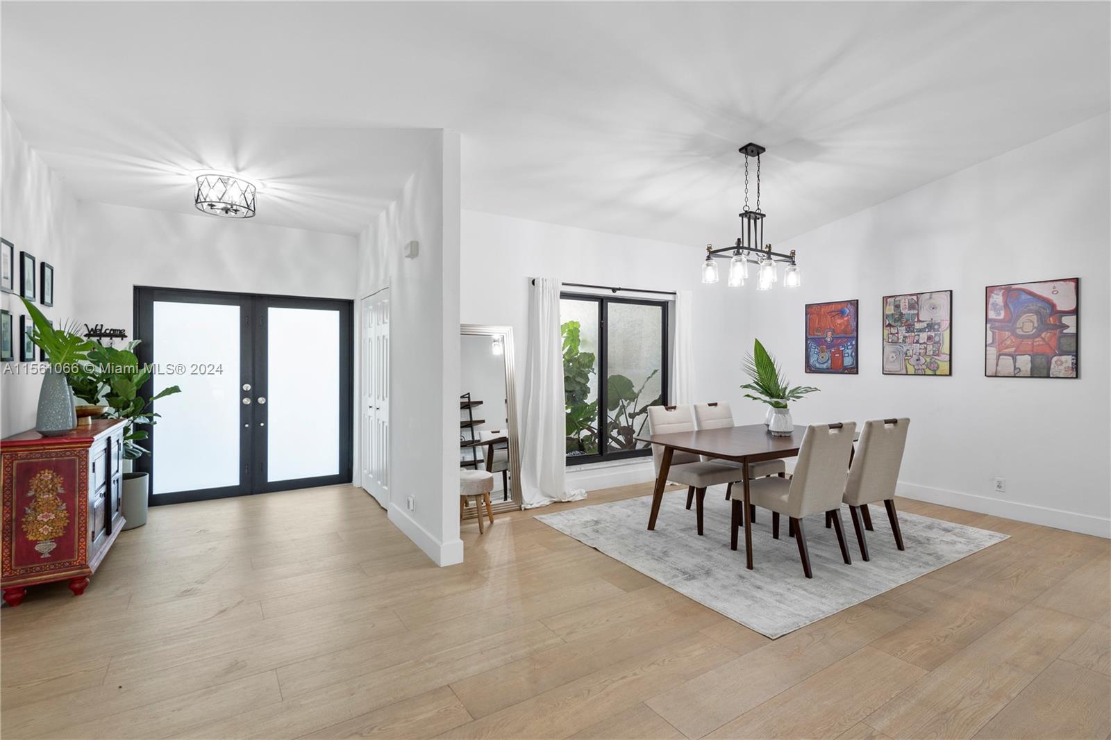 501 Ranch Road Weston, FL 33326 - Photo 10 of 50 a view of a dining room with furniture window and wooden floor