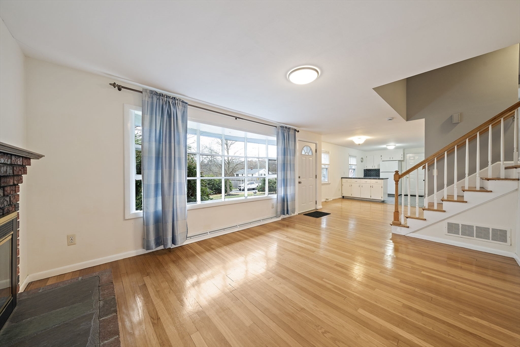 12 Stellar Road Braintree, MA 02184 - Photo 11 of 25 a view of an empty room with wooden floor and a window
