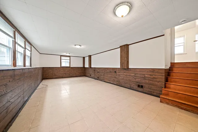 a view of an empty room with windows