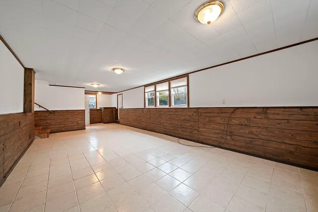 a view of an empty room and a window