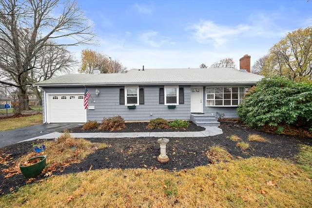 a front view of a house with yard