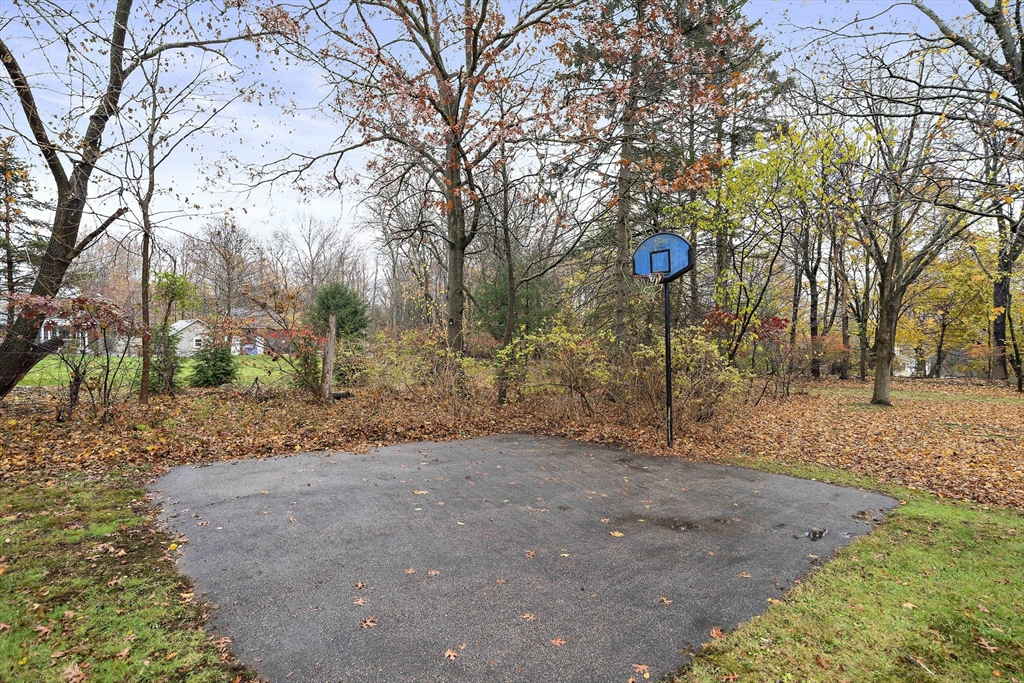 12 Stellar Road Braintree, MA 02184 - Photo 23 of 25 a view of a yard with a tree