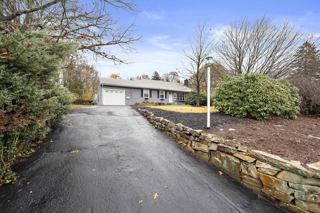 12 Stellar Road Braintree, MA 02184 - Photo 3 of 25 a view of a house with backyard and trees