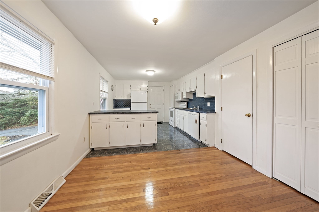 12 Stellar Road Braintree, MA 02184 - Photo 9 of 25 a view of kitchen with cabinets and wooden floor