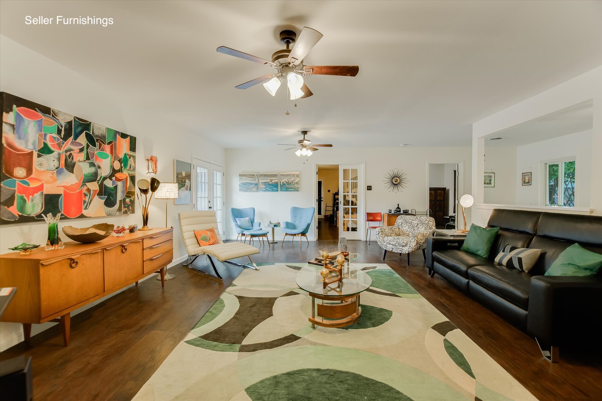 1601 East 19th Street Georgetown, TX 78626 - Photo 7 of 31 a living room with furniture kitchen view and a chandelier