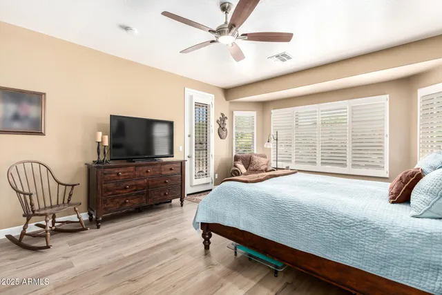 a spacious bathroom with a shower sink and mirror
