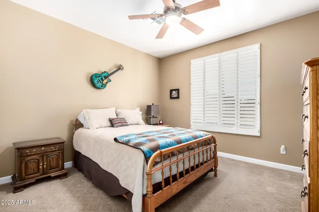 a bedroom with a bed and a dresser